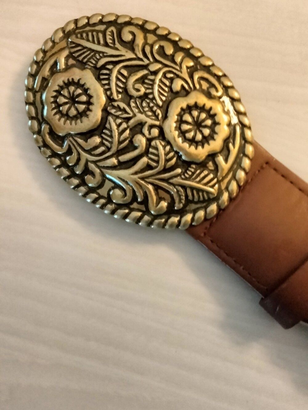 Embossed Floral Gold Oval Belt Buckle on Brown Leather Belt